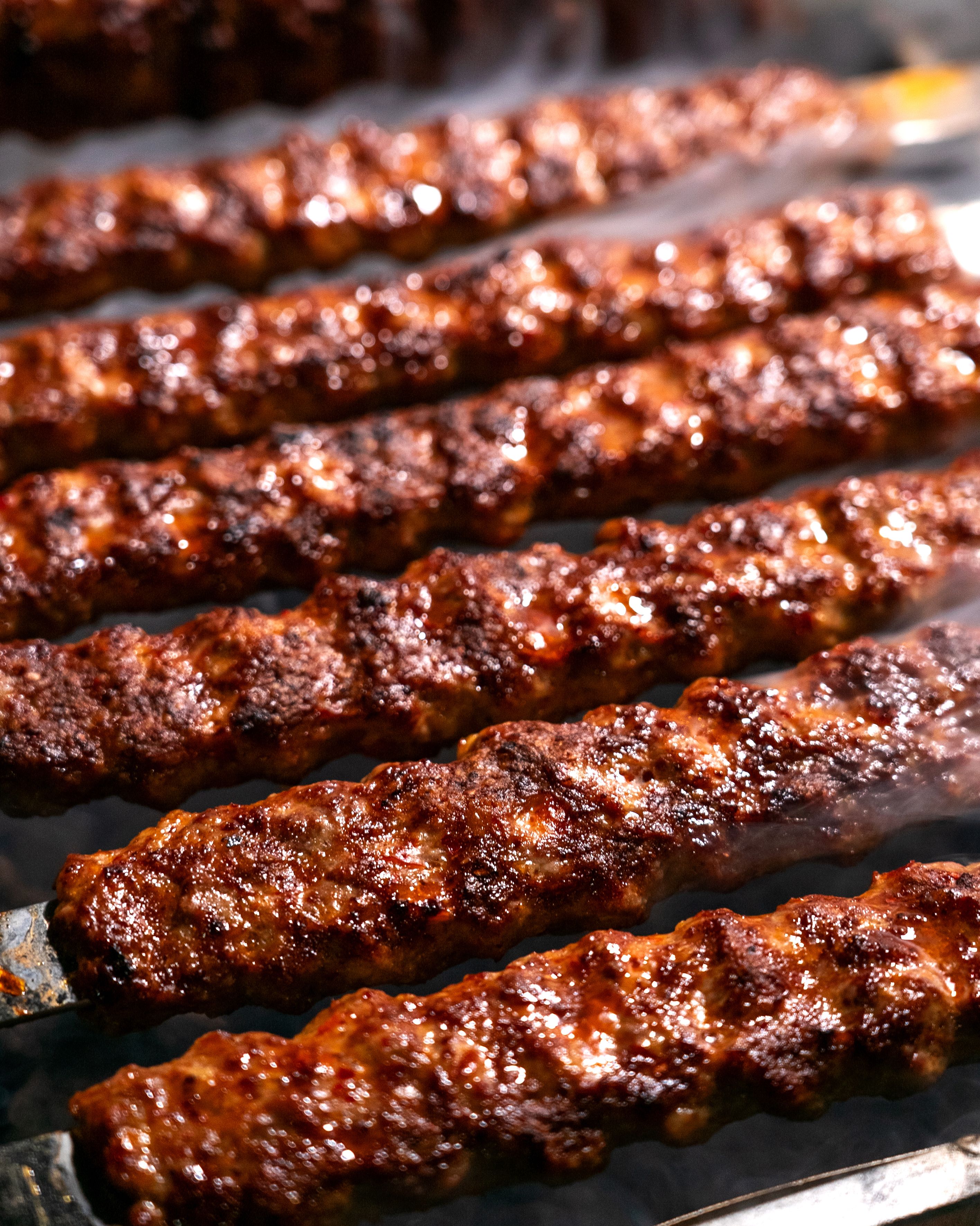 Charcoal-grilled seekh kebab skewers
